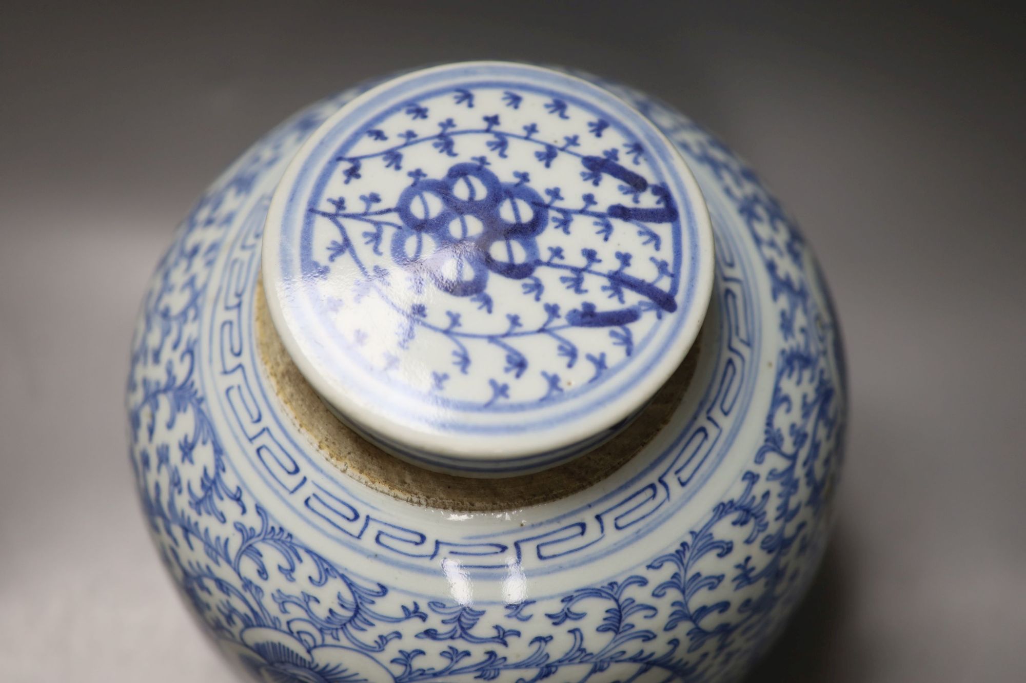 A 19th century Chinese blue and white jar, with associated cover, height 22cm